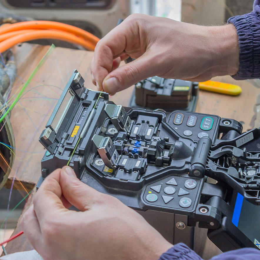 Technician working on network cabling